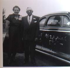 Ernie and Rita by their honeymoom car