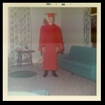 Dennis in his graduation gown