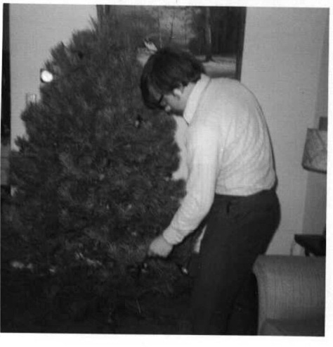 Dennis Knuth trimming Gloria's Christmas Tree