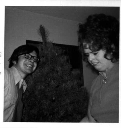 Dennis and Gloria Hillestad trimming a Christmas Tree