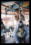 Helenice rides the merry-go-round