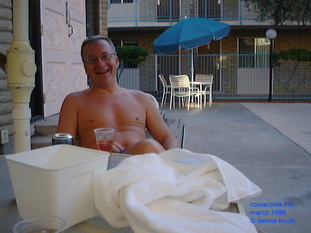 Dennis Knuth laughs by the pool