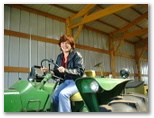 Rose Drives a John Deer Tractor at Sherri and Gary's May 12 2000