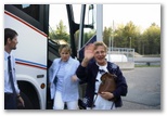 Nancy waves as the exits the bus