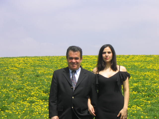 Patricia Silesa and Helton in a field of dandelions