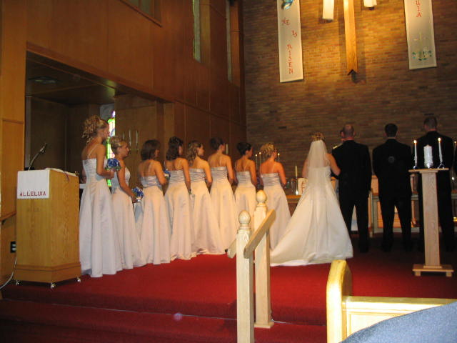 Bridesmaids are lined up at the altar