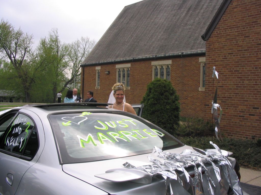 Kelly at the just married car