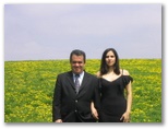 Patricia Silesa and Helton in a field of dandelions