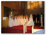 Bridesmaids are lined up at the altar