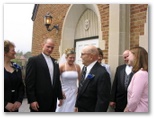 Grandpa John Knuth laughs with the newly weds