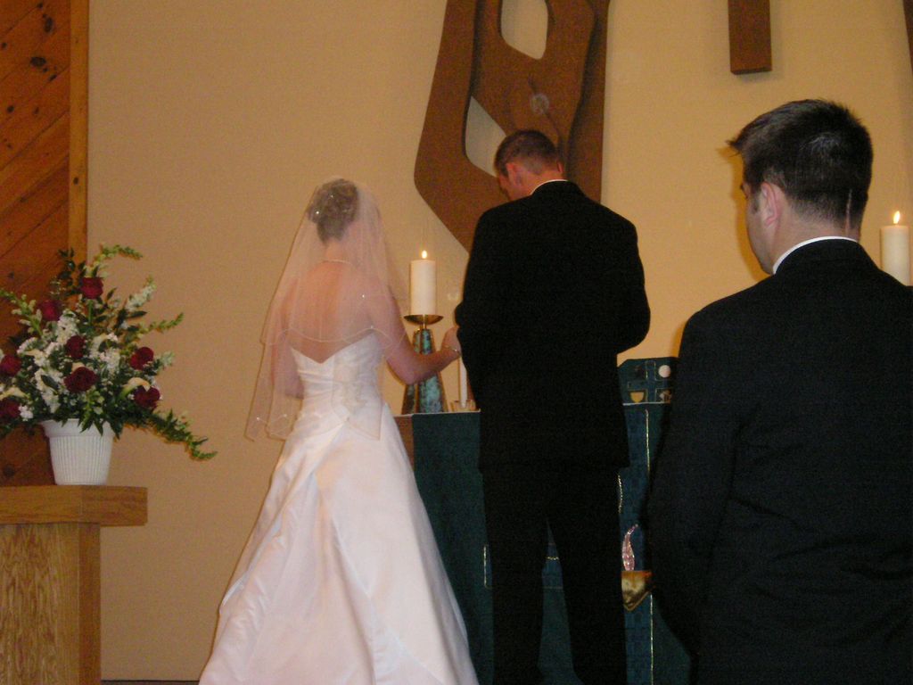 Lighting candles at the Altar