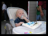 Eating the first birthday cake at home
