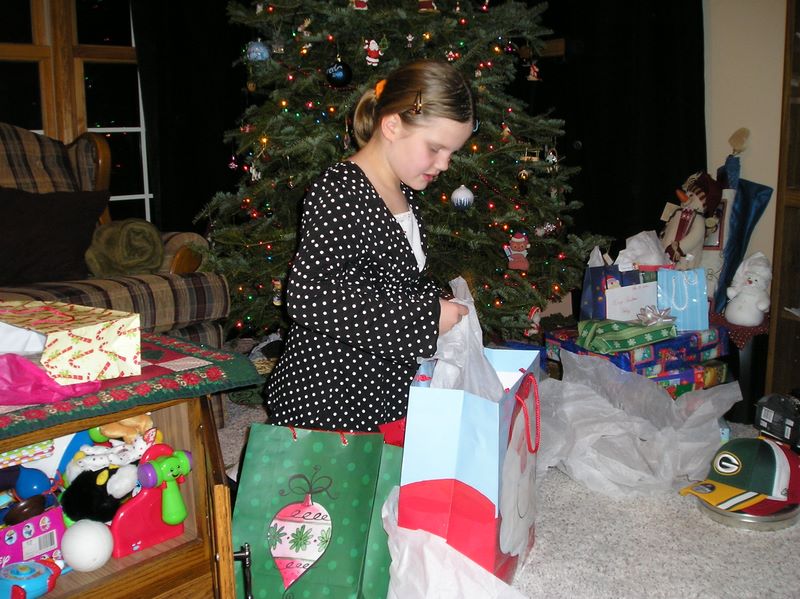 Kelsy opens her presents