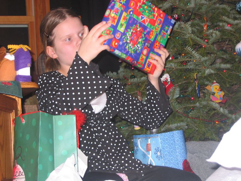 Kelsey examines her Christmas Gifts