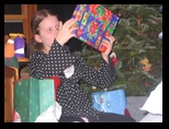 Kelsey examines her Christmas Gifts