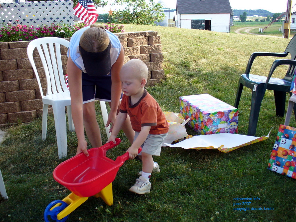 Kelsey shows Jared how to use a wheelbarrow