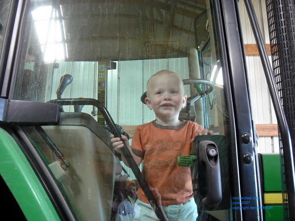 Jared's happy to ride in Gary's tractor