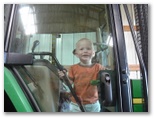 Jared on the tractor smiles