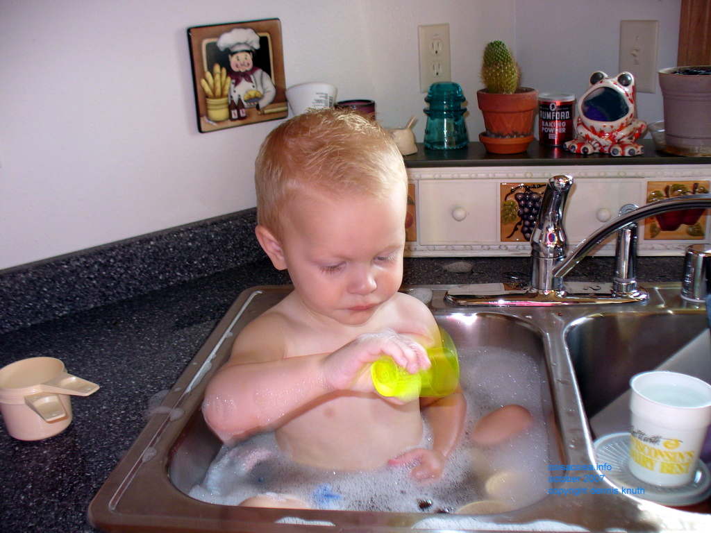 Jared takes a bath in Grandma's kitchen Sink