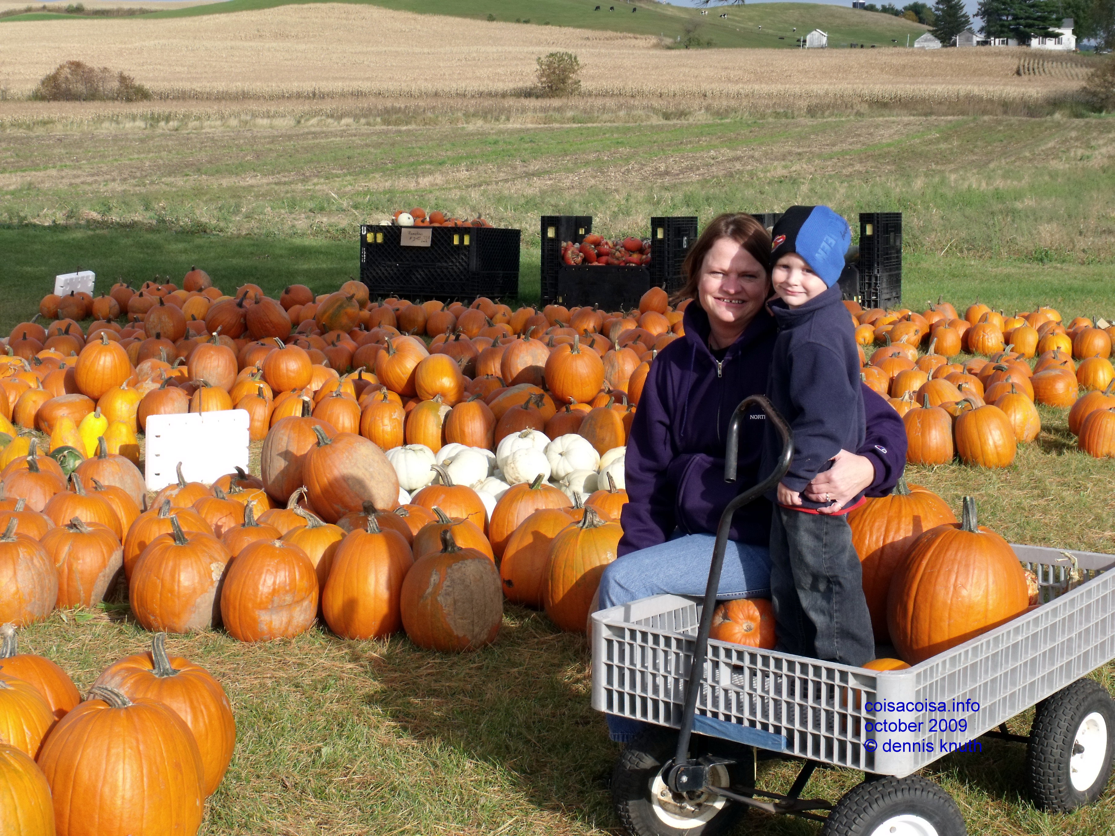 Sherri and Jared smile in the pumpkin patch