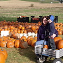 Smiles on a pumpkin picking wagon