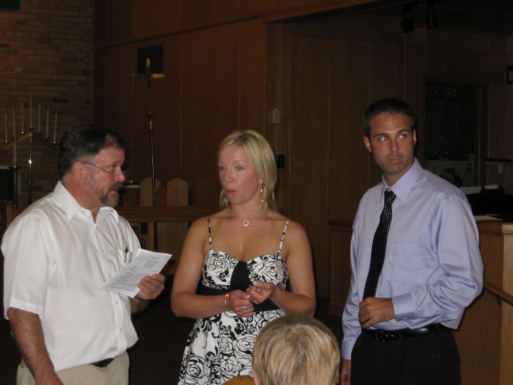 The Pastor, the Bride and the Groom Rehearse