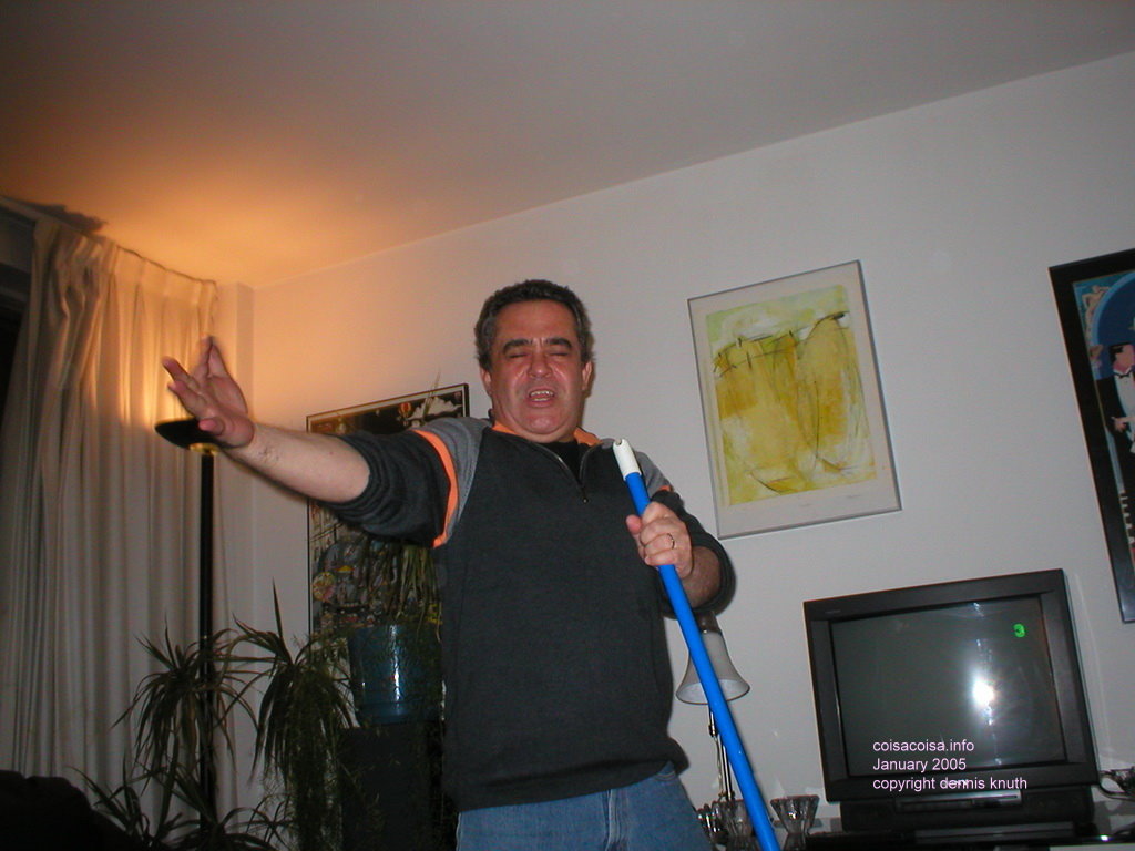 Helton Sing with a Broom as a Microphone