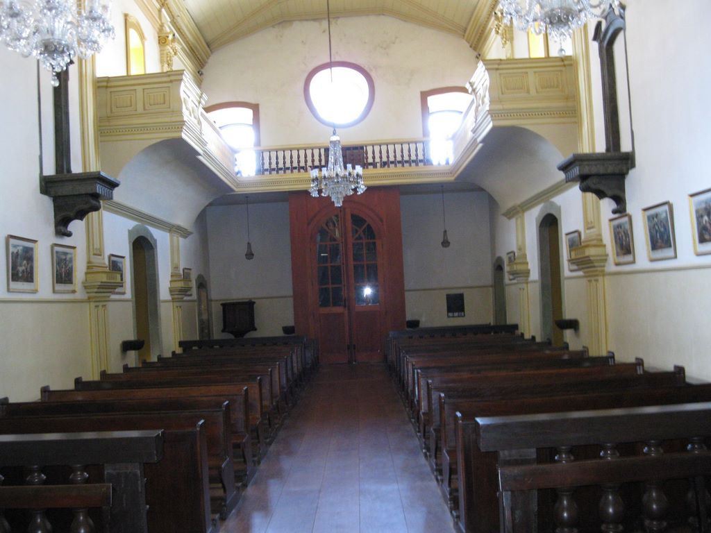 The church entrance and pews in the Oliviera Church
