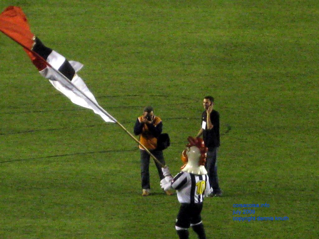 Belo Horizonte Galo mascot waves the flags