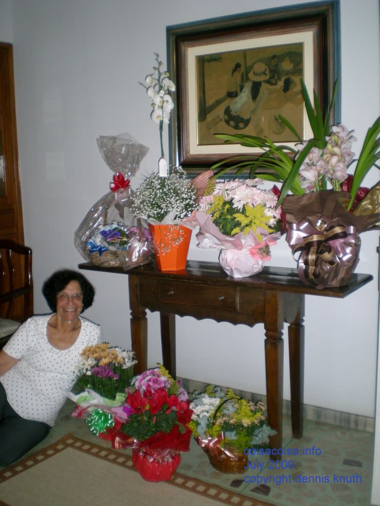 Smiling Vicentina with her flowers