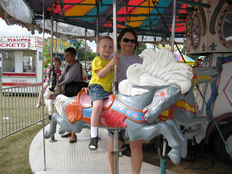 Sherri and Jared on a Merry - Go - Round
