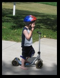 Jared on his Scooter with a Helmet