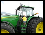 Little Jared on a big big John Deere tractor