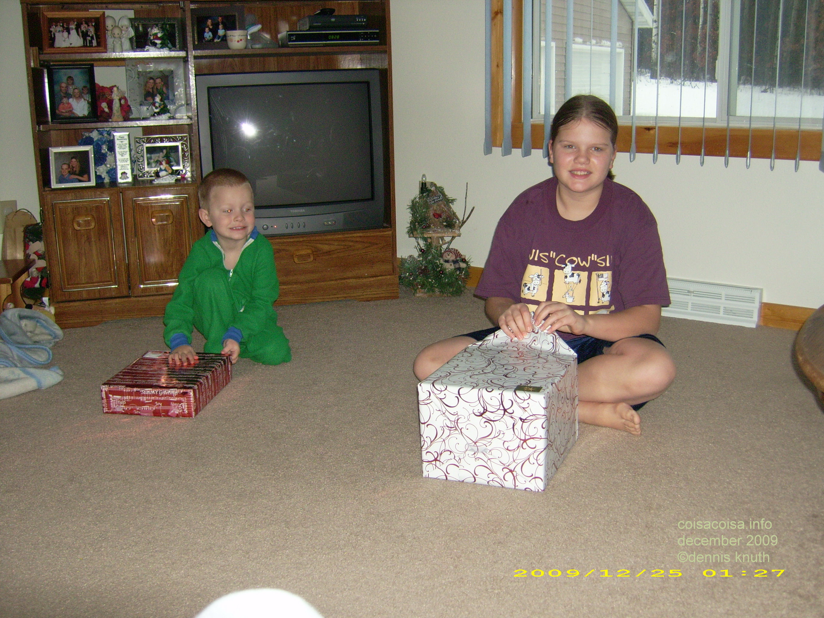 Kelsey opens the first gift and Jared watches