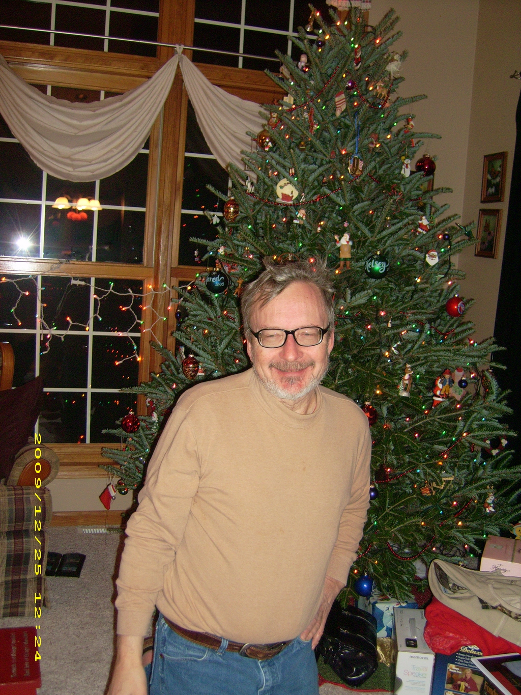 Self pleased Dennis Knuth in front of the Christmas Tree