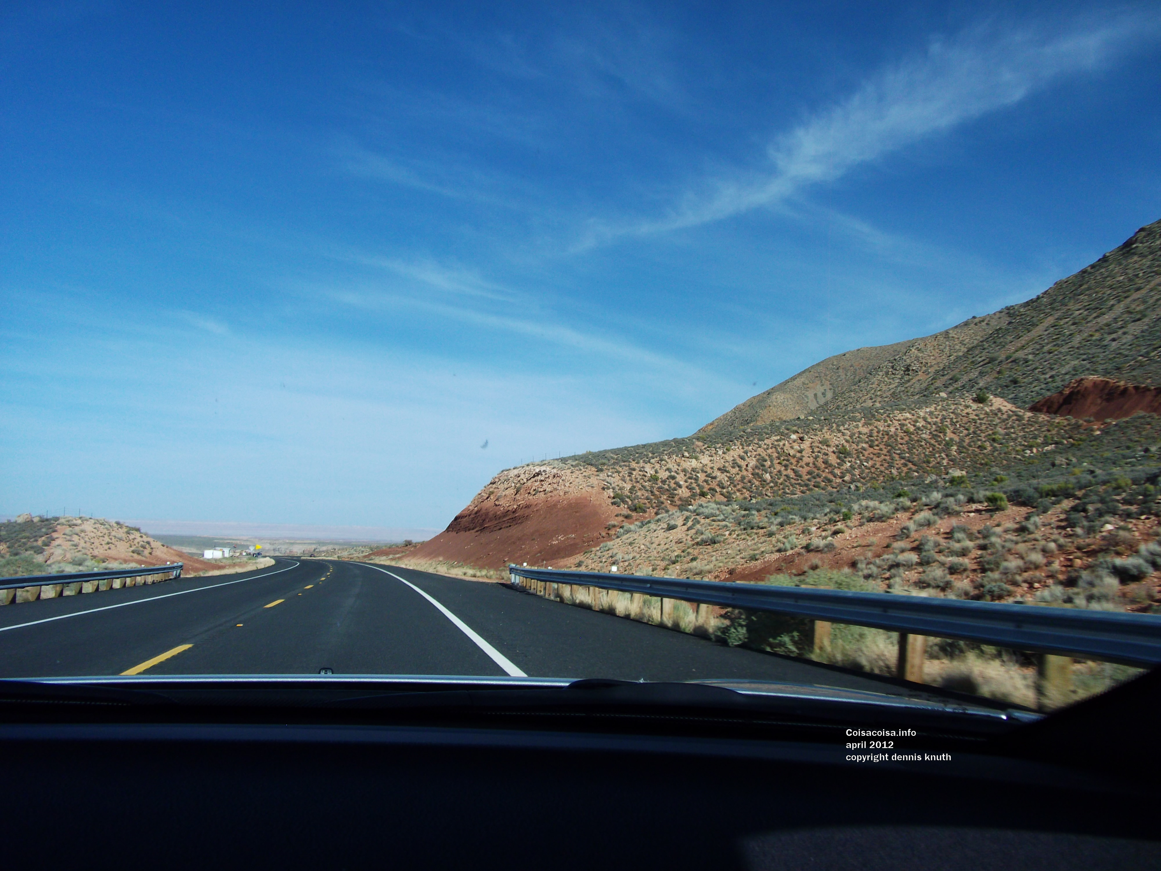 Painted Desert on the Horizon of the Car Dashboard