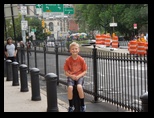 Jared sitting on a post in New York City
