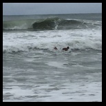 Surfer finishes his ride