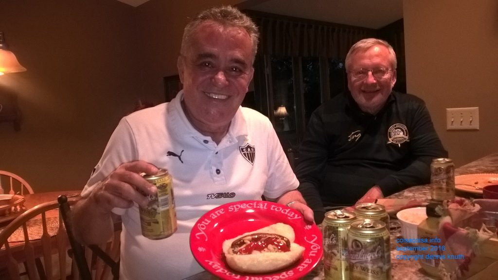 Helton shows off his bratwurst and beer