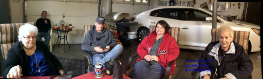 A panorama of Gloria and Ruth visting in the garage