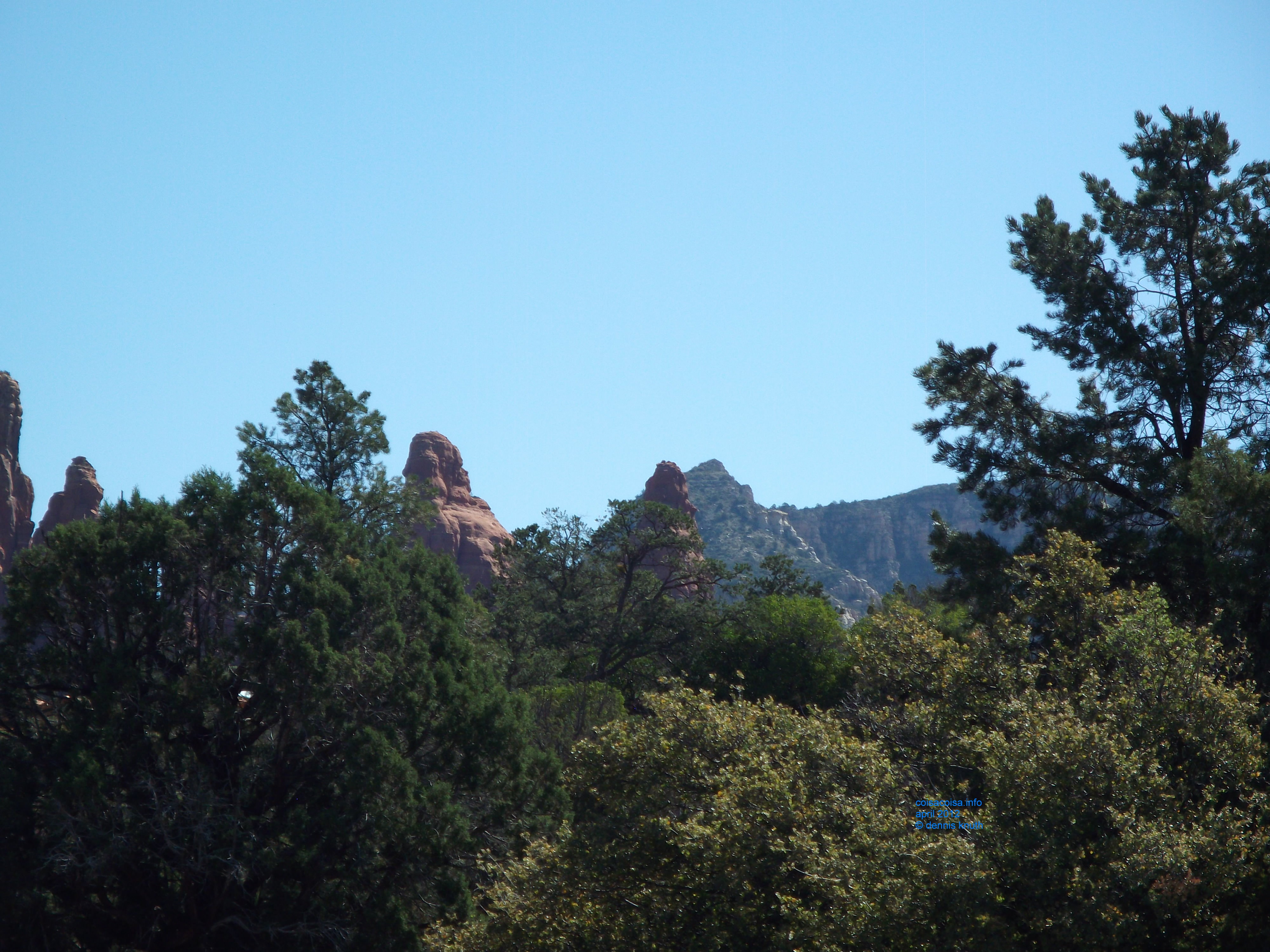 Red Rocks Peaks peek through the flora