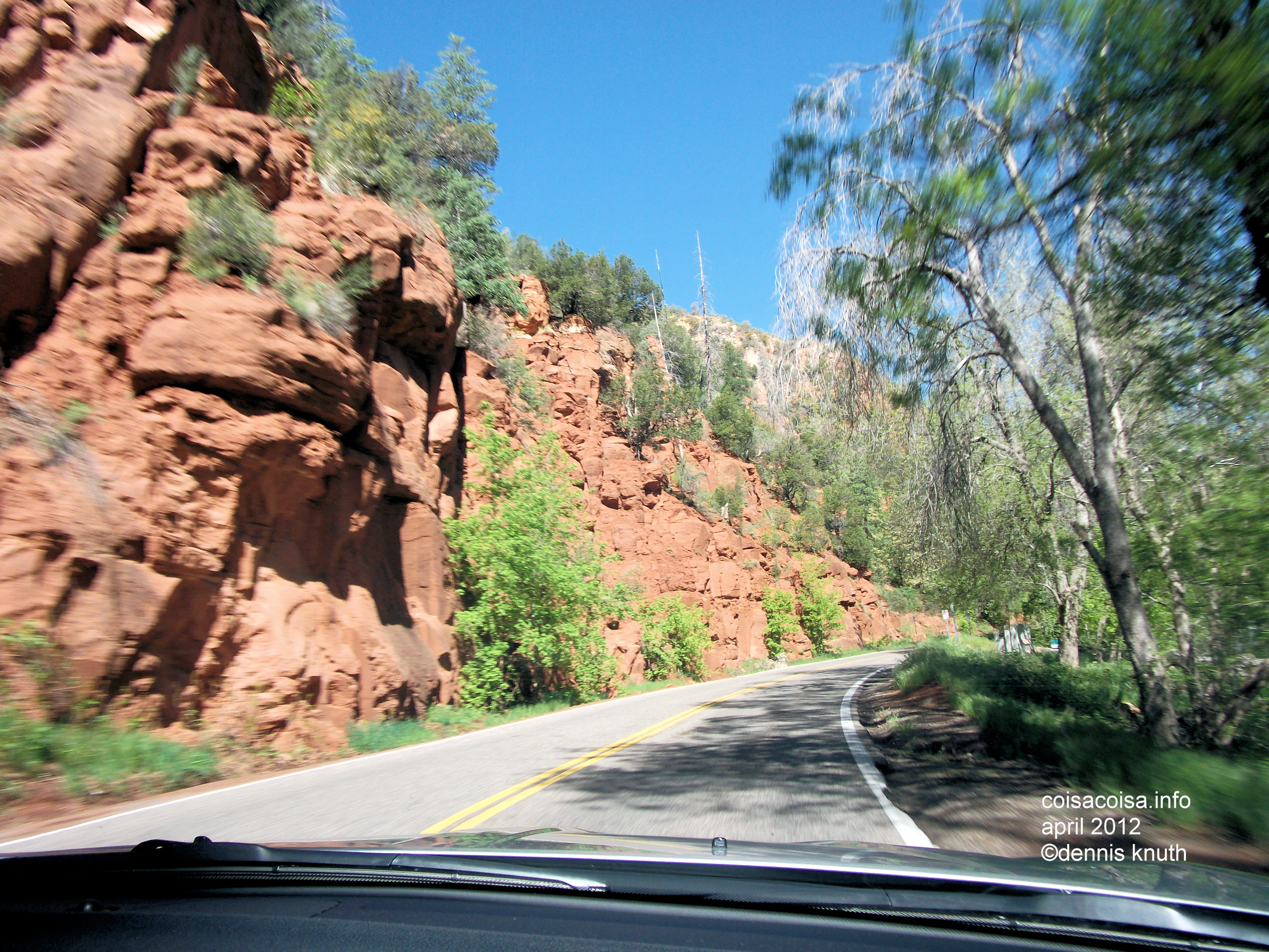 Red Rocks blur while we speed in Oak Creek Canyon
