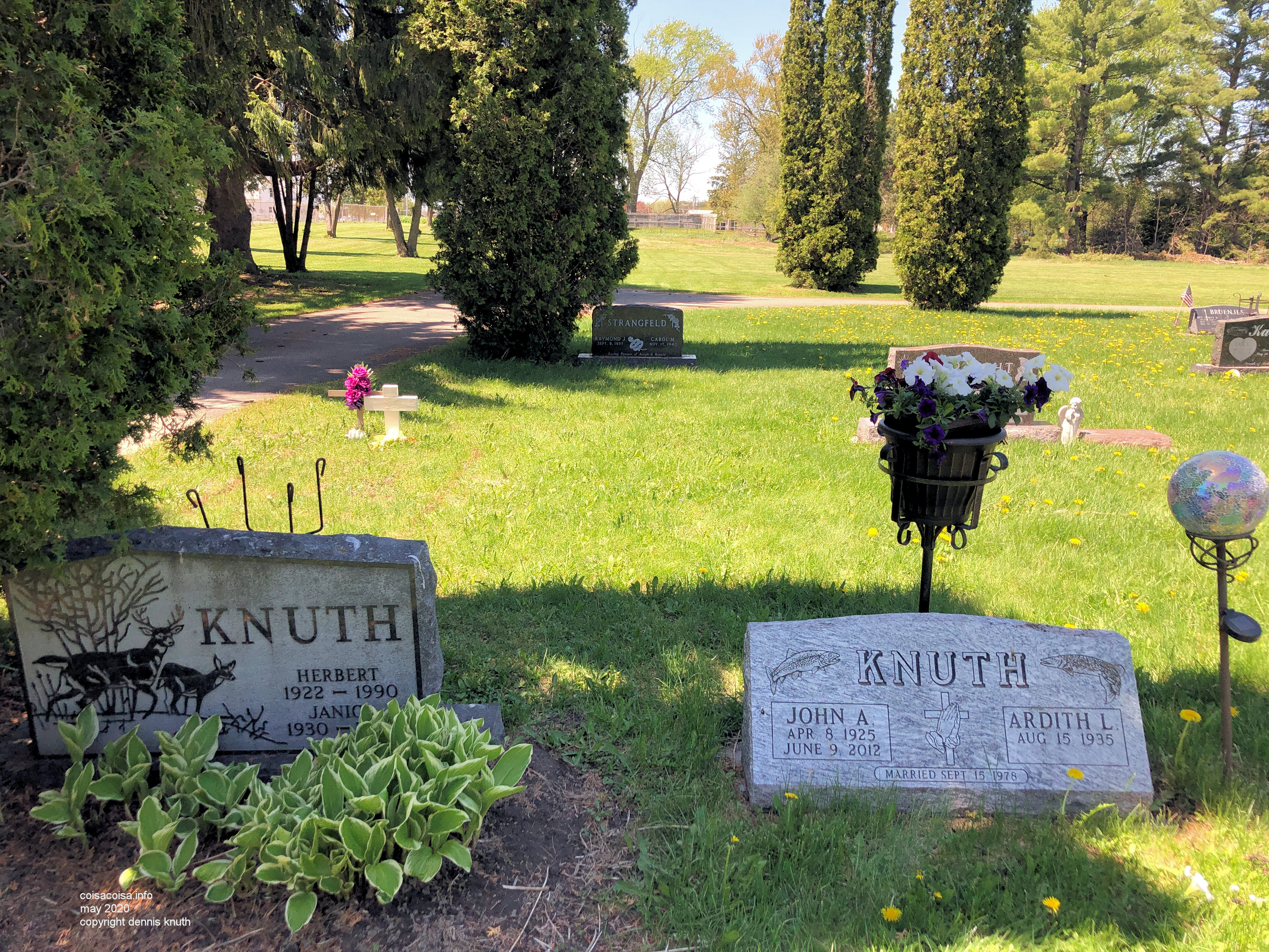 Planting some flowers on John Knuth's grave in Augusta Wisconsin