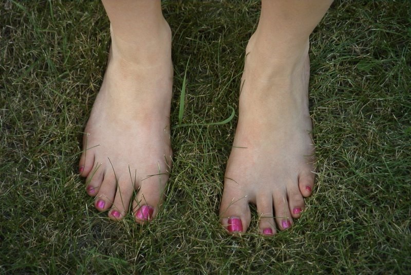 Teen Woman's Feet and Toes on a lawn