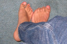 Mans feet on blue